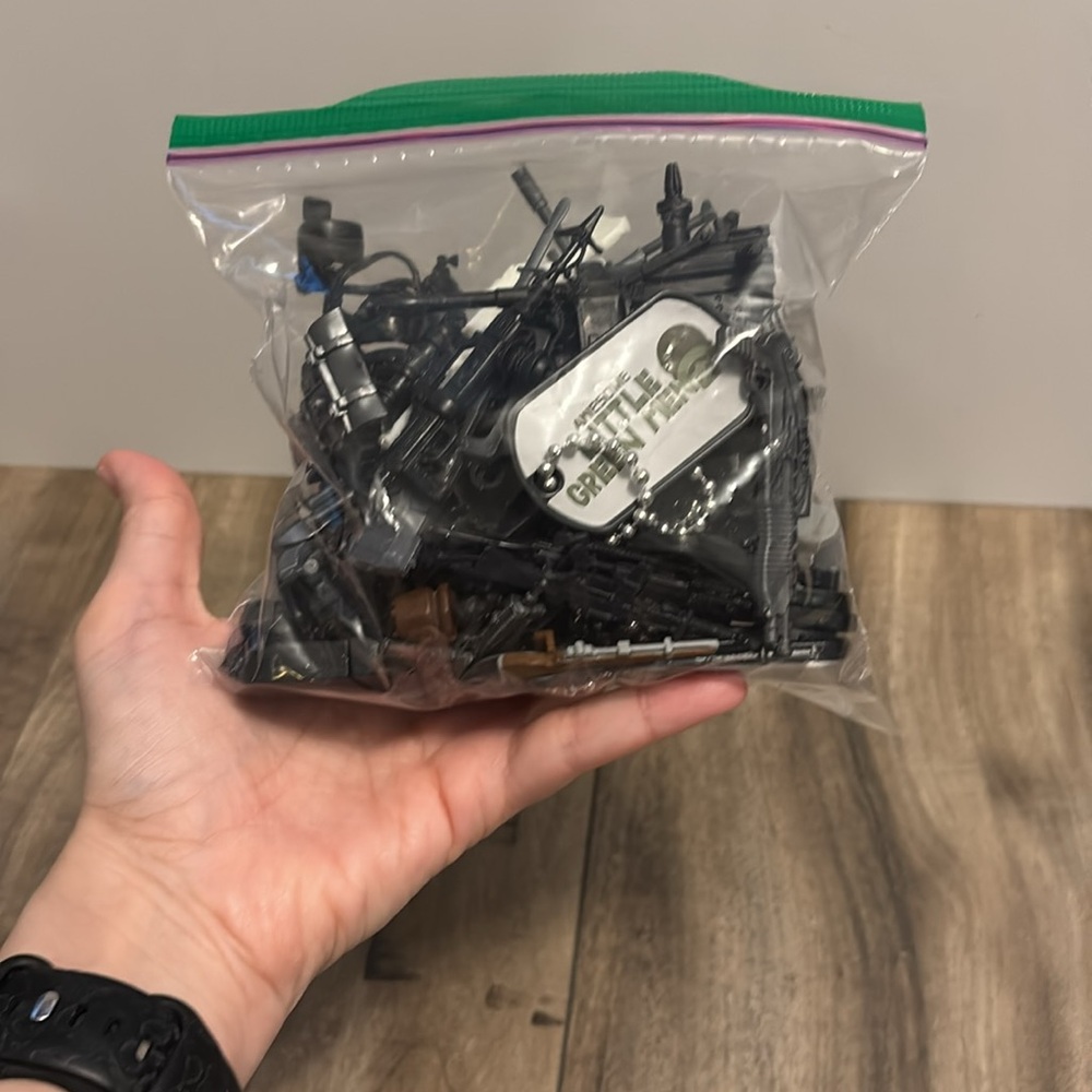 Bag of action figure weapons